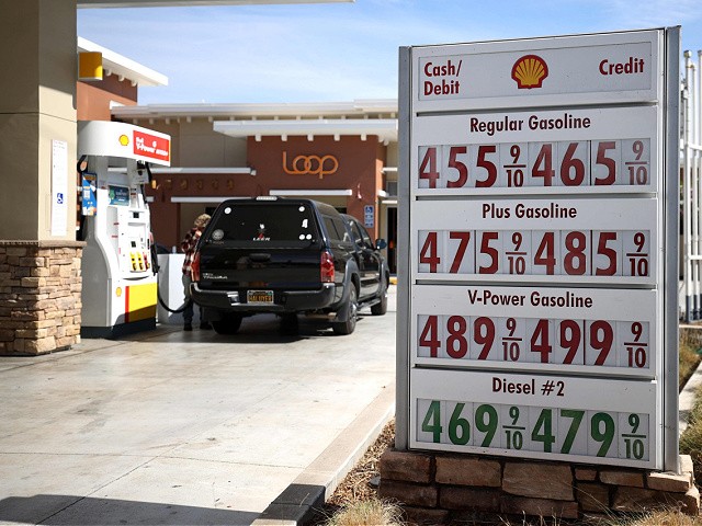 Gas prices approaching $5 a gallon are displayed in front of a Shell gas station on October 05, 2021 in San Rafael, California.